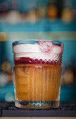 Creative cocktail in night club bar background