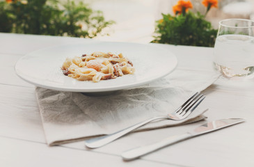 Traditional italian pasta carbonara with bacon and egg