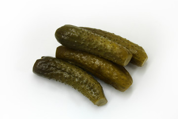 Pickled cucumbers on a white background.