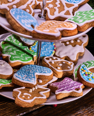 Close up of Christmas gingerbread cookies on Tiered Cookie Stand.
