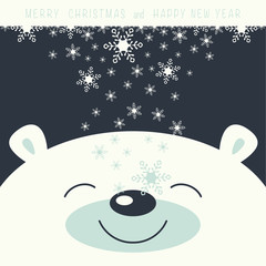The cover design. Depicts face smile little polar bear on the dark background. The falling snowflakes on the face polar bear. Phrase merry Christmas and a happy New year.