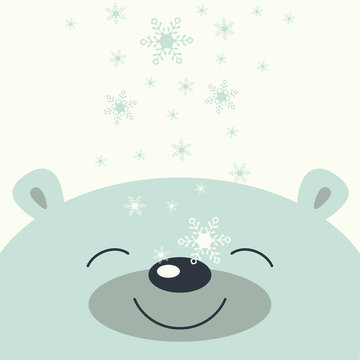 The cover design. Depicts face smile little polar bear on the white background. The falling snowflakes on the face polar bear.