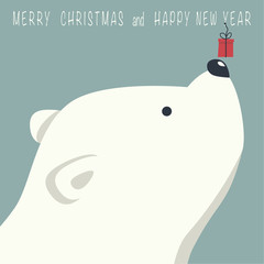 The cover design. Depicts face little polar bear with gift box. Phrase merry Christmas and a happy New year on blue background.