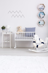Minimalist baby room with cradle