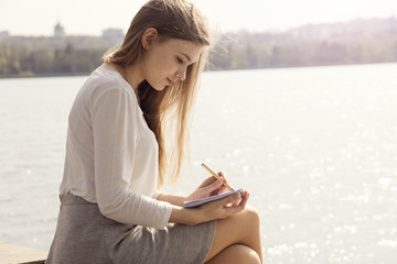 woman drawing on the park.