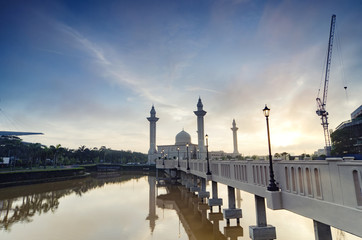 Beautiful floating mosque over magical sunrise background