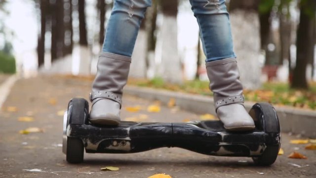 smiling little girl riding on gyroscooter