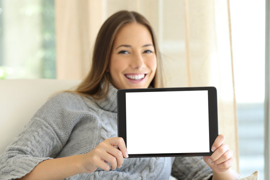 Woman showing blank tablet screen