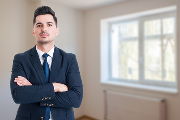 Fototapeta premium Portrait of young realtor with arms crossed