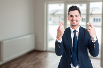 Handsome real estate agent wishing good luck