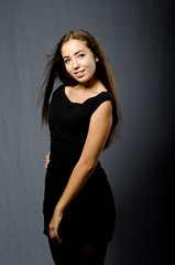 Naklejka premium beautiful girl in black dress