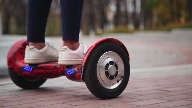 Ride hyroscooter, closeup. feet on hoverboard