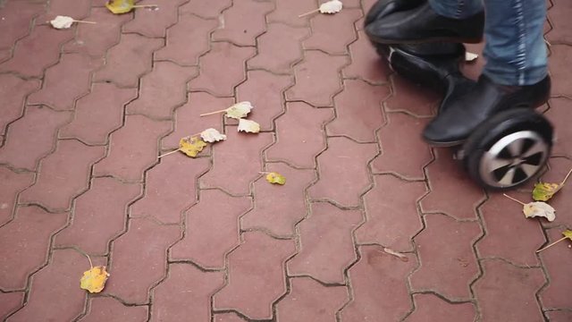 young man perform tricks on gyroscooter