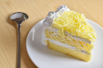 piece of cake with whip cream and grated cheese topping