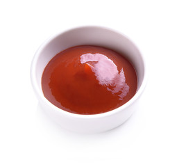 Ceramic cup ketchup on white background