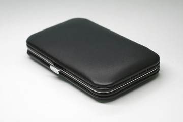 Black small imitation leather cases on white background
