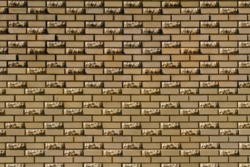 Brick wall made of light yellow facing bricks