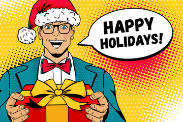 Christmas pop art man. A man in Santa Claus hat, suit and glasses with smile holding gift box and Happy Holidays speech bubble.