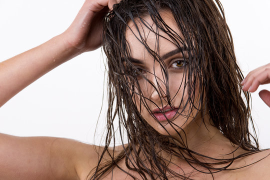 Sexy  woman with wet hair beauty on white