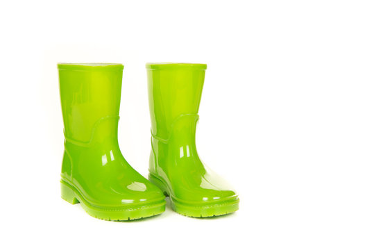 Green Shiny Child Rain Boots On A White Background