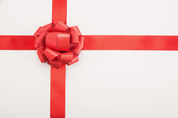   Decorative red ribbon and bow on a white background 