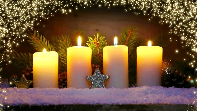 Four burning advent candles and luminous lights.