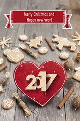 Christmas heart shaped gingerbread background. Winter holidays atmosphere. Snoflakes. Greeting card for Christmas and New Year`s Eve holiday 2017.Winter holiday poster.