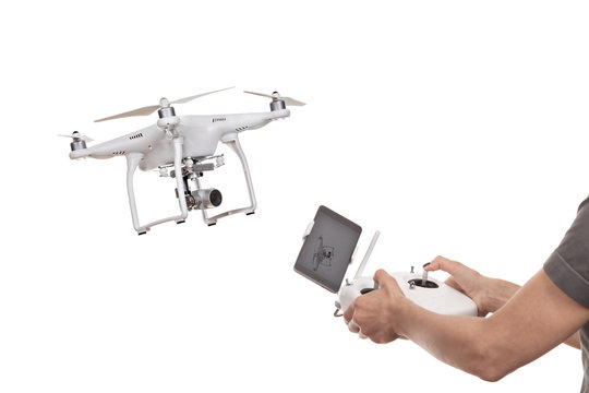  Female hands operating drone quadrocopter.