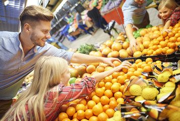 Family shopping in the fruits section