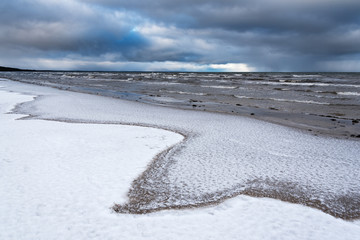 Snowy coast , gulf of Riga, Baltic sea.