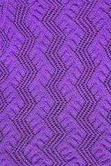 purple knitted openwork vertical background closeup