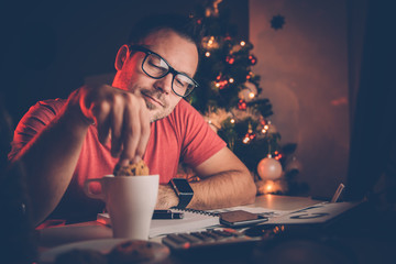 Man dipping a cookie in coffee