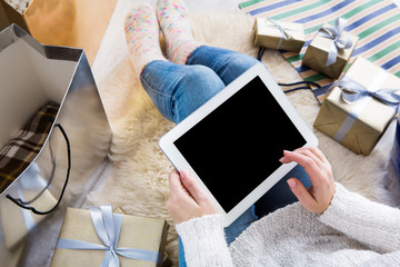 Woman shopping online with a credit card