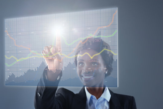 African business woman analysing stock shares graph holograms