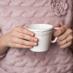 beautiful woman's hands with a cup