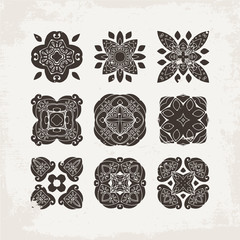 Set of ornate vector mandala symbols. Mehndi lace tattoo. Oriental weave.