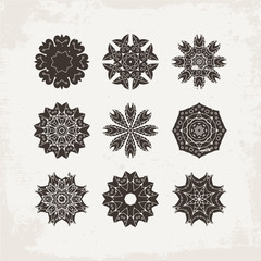 Set of ornate vector mandala symbols. Mehndi lace tattoo. Oriental weave.