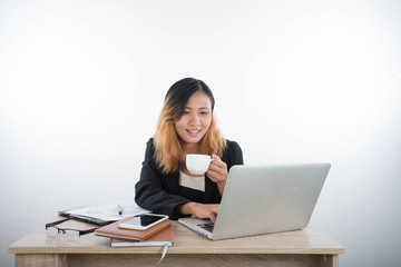 Young business woman with laptop notebook and smartphone in the