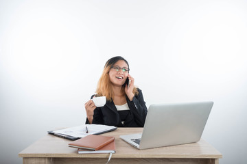 Young business woman with laptop notebook and smartphone in the