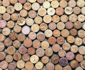 many different wine corks in the background