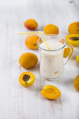 Fototapeta premium Smoothie or yogurt with blueberries on a wooden table. Delicious