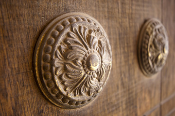 Ornate decorative element of wood on the door