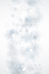 Winter abstract background with snowflakes and shines