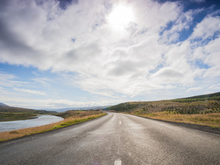 Empty road with a blue cloudy sky, Iceland