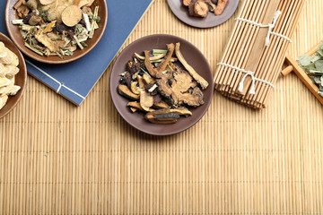 Traditional Chinese medicine on bamboo desk