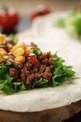 open tortilla with beef, frillice and corn, organic fastfood
