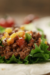 open tortilla with beef, frillice and corn, organic fastfood