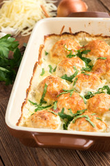 Chicken balls in cream sauce .