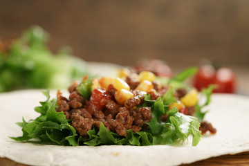 open tortilla with beef, frillice and corn, organic fastfood