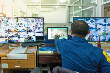 industry Security System. - Control room operator. Security video surveillance with observer and...